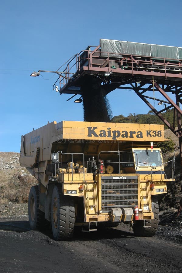 Truck loading up with 100 ton of coal at Stockton Coal Mine, West Coast, South Island, New Zealand. Truck loading up with 100 ton of coal at Stockton Coal Mine, West Coast, South Island, New Zealand