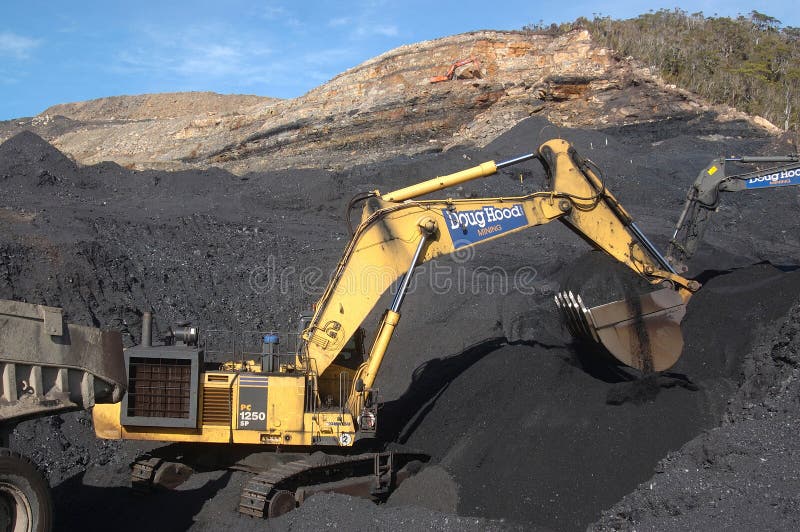 Diggers scoop up high grade doal at Stockton Coal Mine, West Coast, South Island, New Zealand. Diggers scoop up high grade doal at Stockton Coal Mine, West Coast, South Island, New Zealand