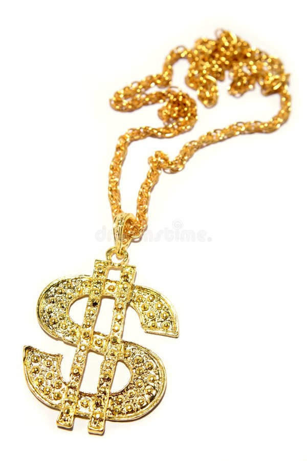 A gold dollar sign necklace isolated on a white background. A gold dollar sign necklace isolated on a white background.
