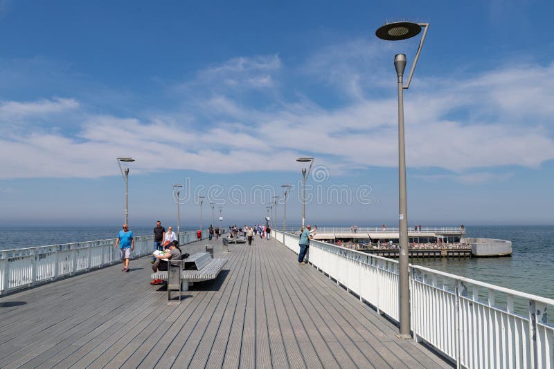 Kolobrzeg, zachodniopomorskie / Poland - May, 21, 2019: Pier in a holiday resort by the sea. A place of rest in Central Europe