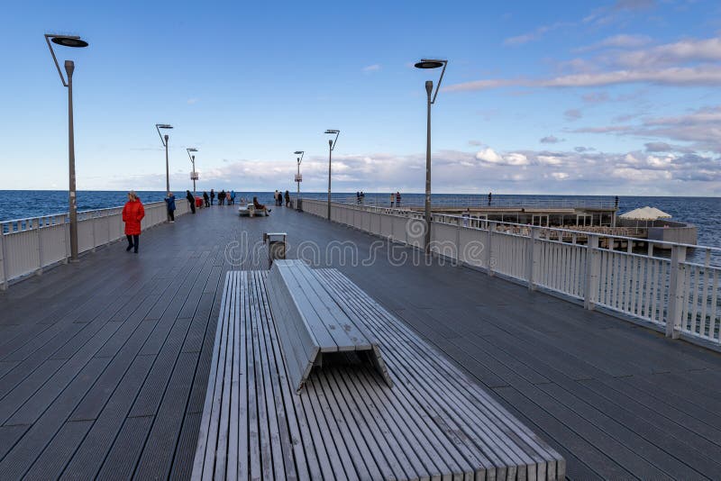 Kolobrzeg, zachodniopomorskie / Poland - October, 30, 2019: Pier in a holiday resort by the sea. A place of rest in Central Europe