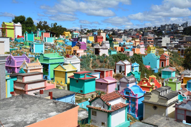 The picturesque graveyard of Chichicastenango in Guatemala with its colorful tombs and tombstones which makes a very photogenic landmark in this small market village. The picturesque graveyard of Chichicastenango in Guatemala with its colorful tombs and tombstones which makes a very photogenic landmark in this small market village.