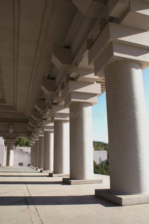 A row of columns with deep shadows. A row of columns with deep shadows