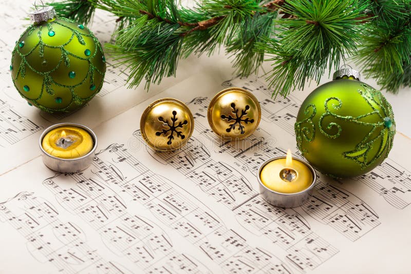 Christmas carol with jingle bells and candles. Christmas carol with jingle bells and candles