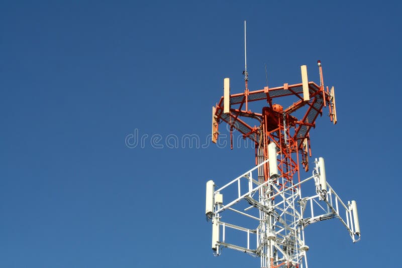 A communications tower against a clear blue sky. A communications tower against a clear blue sky.