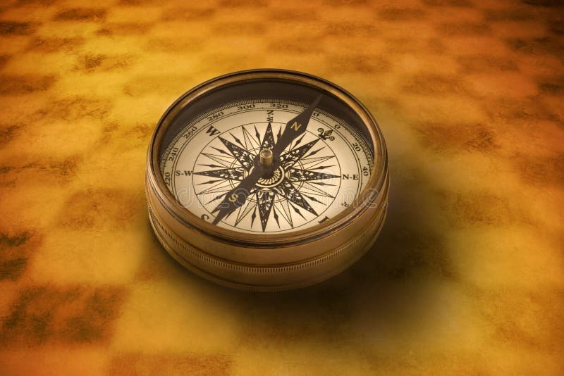 A compass on an abstract warm background. A compass on an abstract warm background