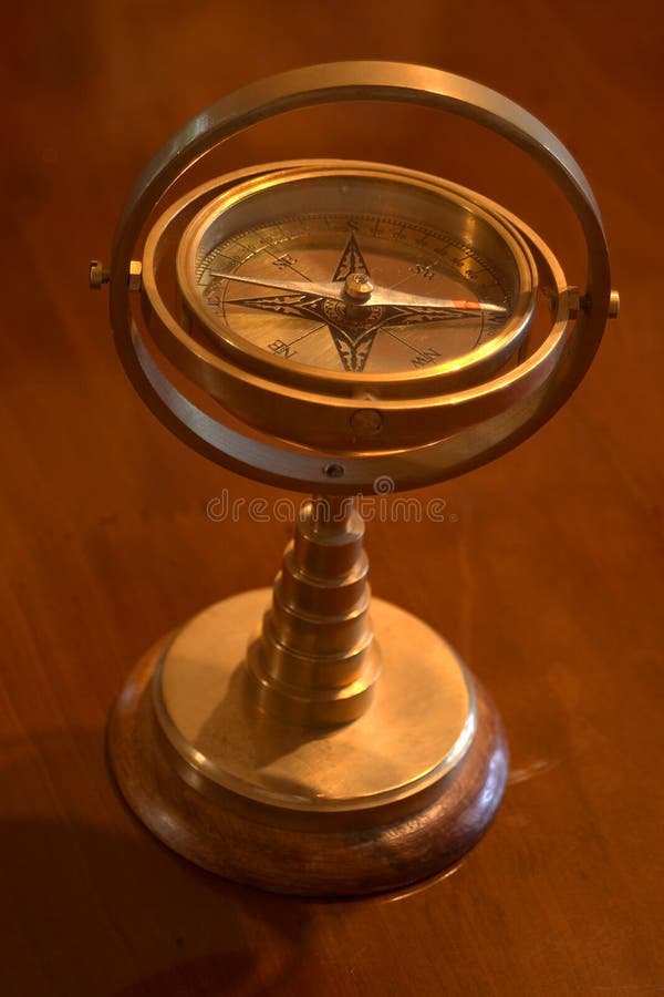 A brass ornamental compass. A brass ornamental compass