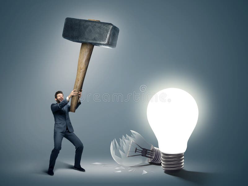 Conceptual image of a businessman holding huge hammer. Conceptual image of a businessman holding huge hammer