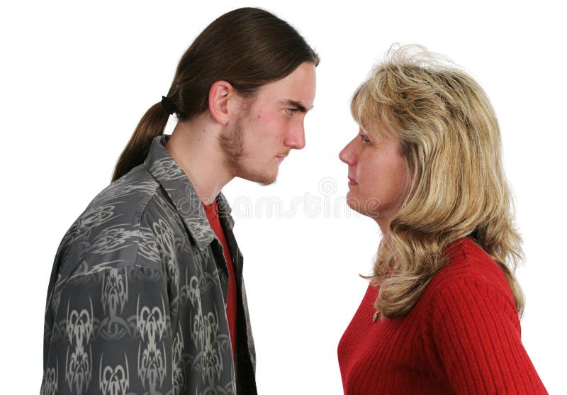 A mother and her teen son having a confrontation. A mother and her teen son having a confrontation.