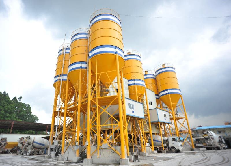 Large yellow concrete mixing plants background sky. Large yellow concrete mixing plants background sky