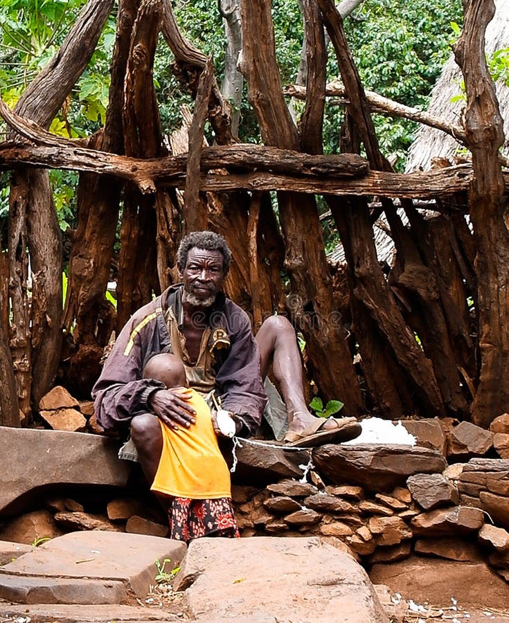 Konso aka Xonsita tribe man with baby - 03 october 2012 , Omo valley, Ethiopia stock photos Konso aka Xonsita tribe man with baby - 03 october 2012 , Omo valley, Ethiopia stock photos