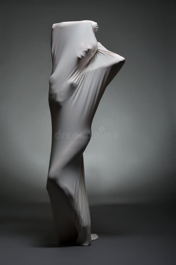Art photo - concept of internal struggle and doubt. Image of screaming female silhouette breaking through fabric. Art photo - concept of internal struggle and doubt. Image of screaming female silhouette breaking through fabric