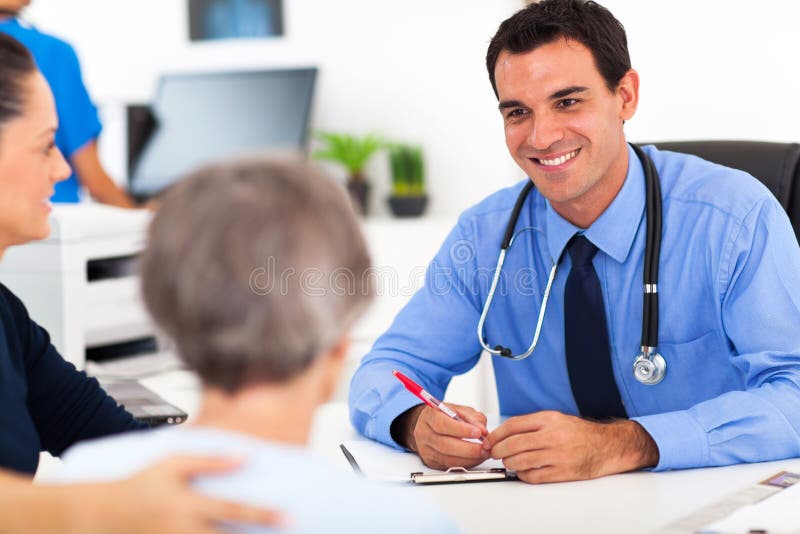 Medical doctor consulting senior patient in office. Medical doctor consulting senior patient in office