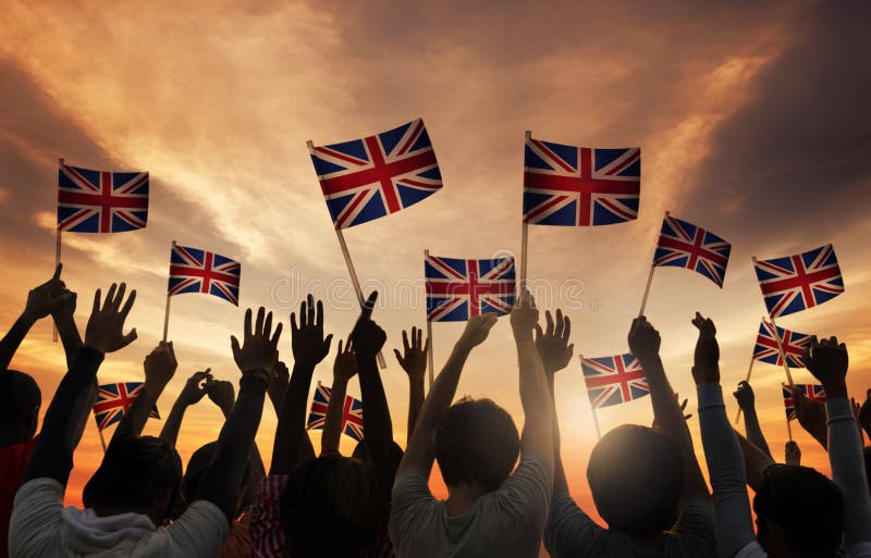 Silhouettes of People Holding National Flag of UK. Silhouettes of People Holding National Flag of UK.