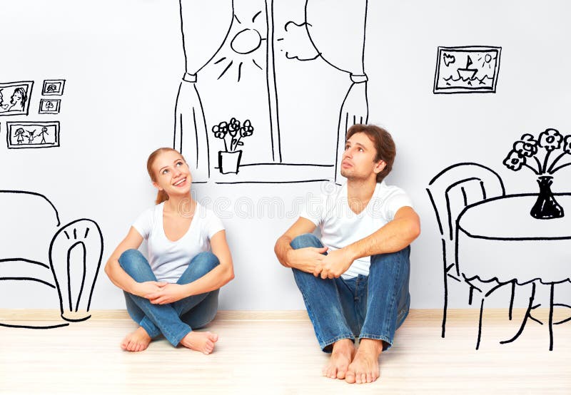 Konzept: glückliches Paar im neuen Wohnungstraum- und -planinnenraum