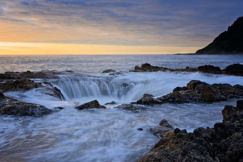 Water rushing into Thor`s Well during dramatic sunset Cape Perpetua Oregon Coast. Water rushing into Thor`s Well during dramatic sunset Cape Perpetua Oregon Coast