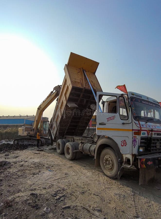 Excavator helping dumper in getting ride off from stucked bushes in. Excavator helping dumper in getting ride off from stucked bushes in