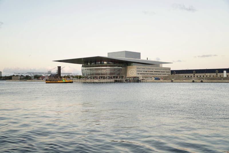 Copenhagen opera building, view from Ofelia plads before sunset, water in front. Copenhagen opera building, view from Ofelia plads before sunset, water in front