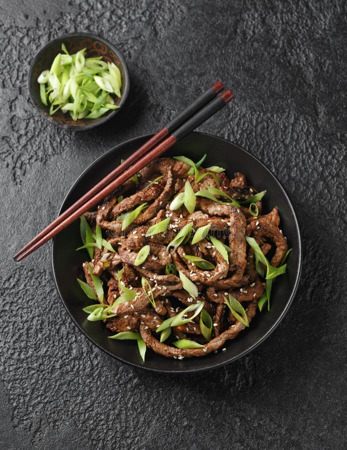 Korean Beef Bulgogi BBQ with Sesame Seeds and Spring Onion. Stock Photo