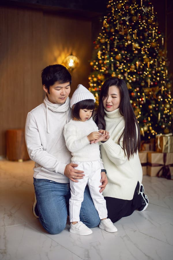 Korean Family Mom Dad and Daughter Child Sitting at the Christmas Tree ...