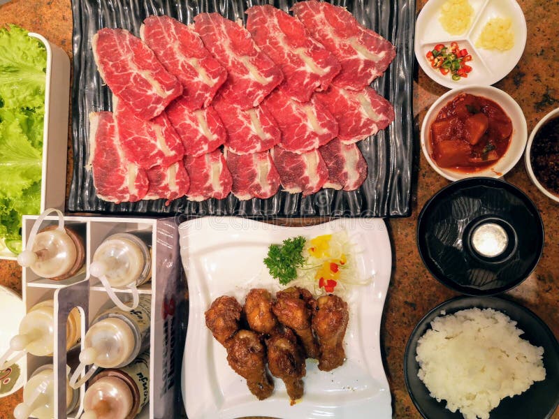 Korean Grilled Pork Tenderlion with Rice and Side Dishes Stock Image