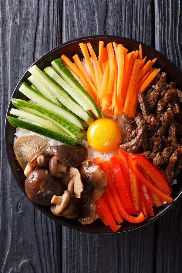 Korean healthy food Bibimbap of rice with fried beef, raw egg, v stock photography Korean healthy food Bibimbap of rice with fried beef, raw egg, v stock photography