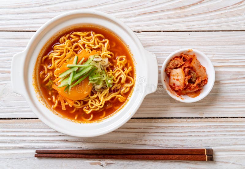 Korean Spicy Instant Noodles with Egg, Vegetable and Kimchi Stock Photo