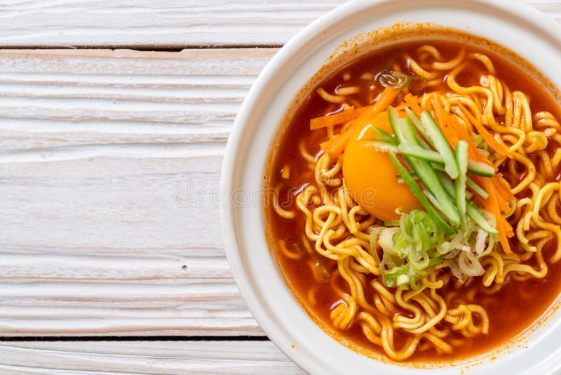 Korean Spicy Instant Noodles with Egg, Vegetable and Kimchi Stock Image