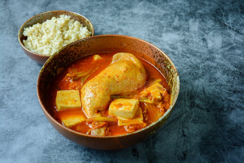 Korean Traditional Kimchi Soup with Chicken and Soft Tofu Stock Photo