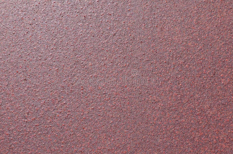 Kornig textur av den rostiga järnplattan som målas i brun färg arkivbild Kornig textur av den rostiga järnplattan som målas i brun färg arkivbild