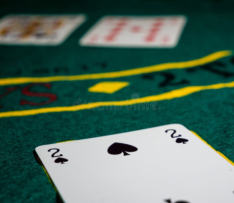 cards with two of spades, texas holdem the gaming table low angle perspective. cards with two of spades, texas holdem the gaming table low angle perspective