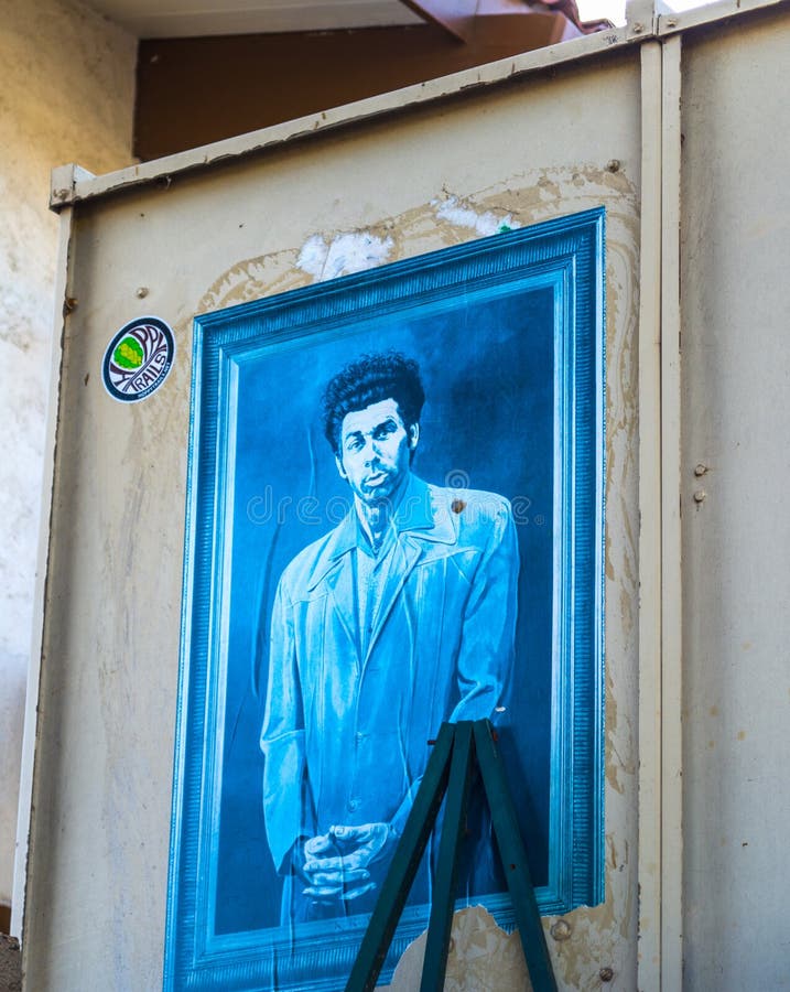 Kosmo Kramer painting on an external house wall