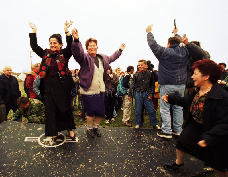 Serbian women dance atop the wing of an United States Air Force F-117A stealth fighter jet, which came down last night in Budjanovci, Serbia, on Sunday, March 28, 1999. US special forces, based in Bosnia, rescued the pilot, who is now in Italy awaiting return to the United States. There is no word yet from NATO on whether the stealth fighter was shot down or crashed because of mechanical failure. Serbian women dance atop the wing of an United States Air Force F-117A stealth fighter jet, which came down last night in Budjanovci, Serbia, on Sunday, March 28, 1999. US special forces, based in Bosnia, rescued the pilot, who is now in Italy awaiting return to the United States. There is no word yet from NATO on whether the stealth fighter was shot down or crashed because of mechanical failure.