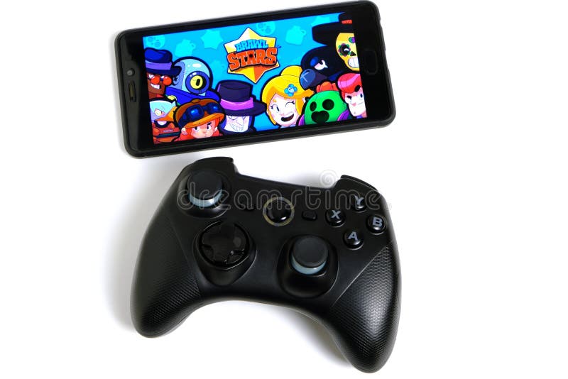 Kostanay, Kazakhstan, February 12, 2020.Joystick and mobile phone with the logo of the popular game Brawl Stars, from Supercell on stock images Kostanay, Kazakhstan, February 12, 2020.Joystick and mobile phone with the logo of the popular game Brawl Stars, from Supercell on stock images