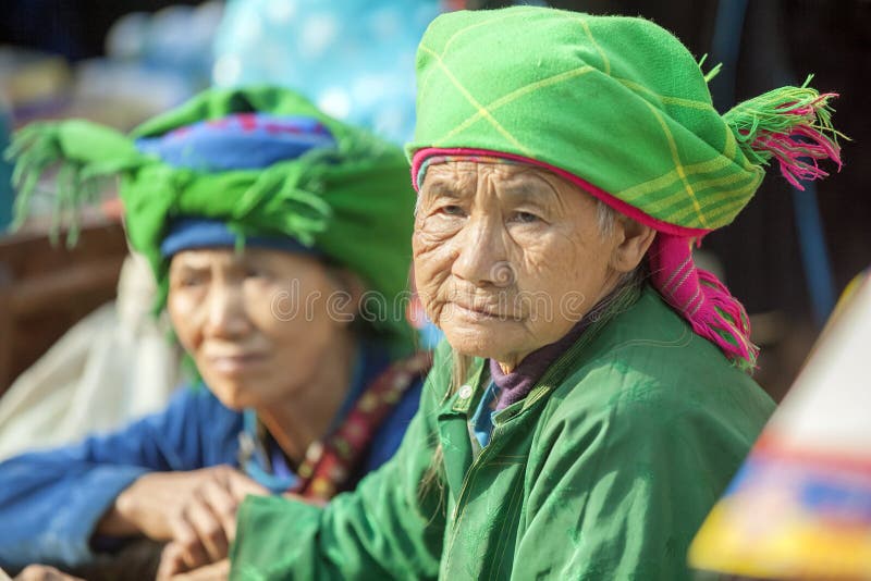 Costumes of ethnic minority women, at old Van market, Ha Giang province, Vietnam. Ha Giang is one of the six poorest provinces of Vietnam. Ha Giang is a famous tourist destination in Vietnam. Photo taken on: 03 May 2011. Costumes of ethnic minority women, at old Van market, Ha Giang province, Vietnam. Ha Giang is one of the six poorest provinces of Vietnam. Ha Giang is a famous tourist destination in Vietnam. Photo taken on: 03 May 2011