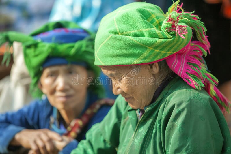 Costumes of ethnic minority women, at old Van market, Ha Giang province, Vietnam. Ha Giang is one of the six poorest provinces of Vietnam. Ha Giang is a famous tourist destination in Vietnam. Photo taken on: 03 May 2011. Costumes of ethnic minority women, at old Van market, Ha Giang province, Vietnam. Ha Giang is one of the six poorest provinces of Vietnam. Ha Giang is a famous tourist destination in Vietnam. Photo taken on: 03 May 2011