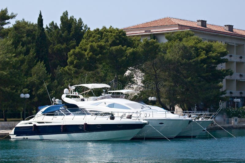 Photo of three yachts anchored at the berth. Photo of three yachts anchored at the berth