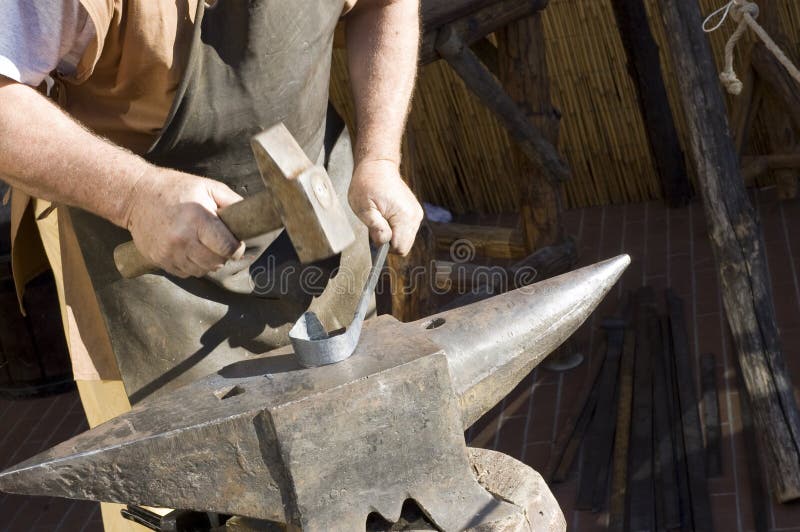 Blacksmith at work - hammer and anvil - detail. Blacksmith at work - hammer and anvil - detail