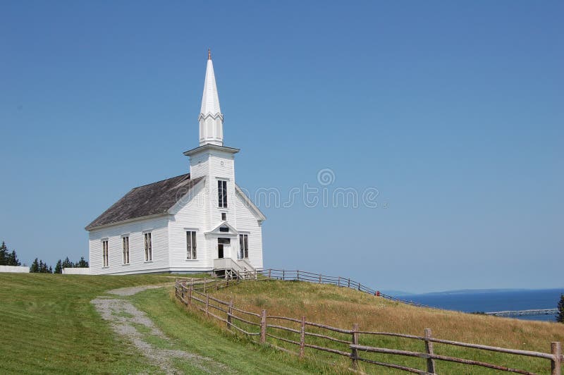 Old white church in nova scotia, canada, overlooking the sea on summer's day. Old white church in nova scotia, canada, overlooking the sea on summer's day