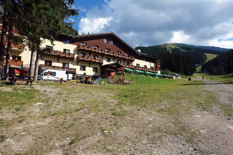 Jasna resort, LOW TATRAS, SLOVAKIA - AUGUST 05, 2013: View on the hotel Druzba, road Biela Put and Chopok mount of summer, Jasna resort in Low Tatras, Slovakia. Jasna resort, LOW TATRAS, SLOVAKIA - AUGUST 05, 2013: View on the hotel Druzba, road Biela Put and Chopok mount of summer, Jasna resort in Low Tatras, Slovakia.