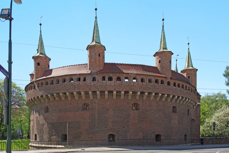 KRAKOW, POLAND - APRIL 29, 2012: This is Barbakan, which was built in the 15th century outside the city walls as an additional fortification. KRAKOW, POLAND - APRIL 29, 2012: This is Barbakan, which was built in the 15th century outside the city walls as an additional fortification.