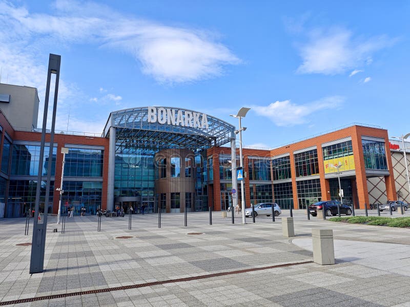 Krakow, Poland, Bonarka City Center shopping mall entrance on a sunny day, wide angle shot, people around. Large modern shopping stock images