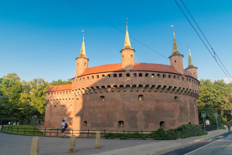 Krakow, Poland - July 27, 2019: Cracow Barbican Polish: Barbakan Krakowski in the morning. Barbican – a fortified outpost once connected to the city walls. Krakow, Poland - July 27, 2019: Cracow Barbican Polish: Barbakan Krakowski in the morning. Barbican – a fortified outpost once connected to the city walls