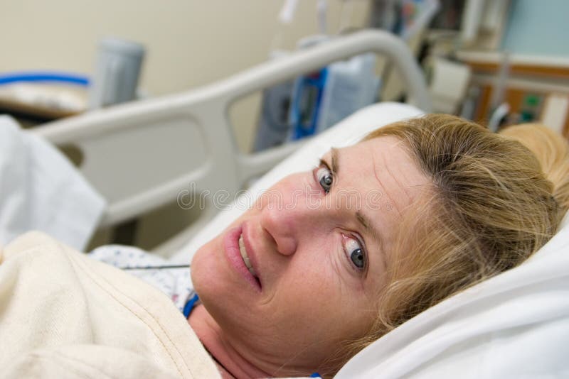 Closeup of Patient in hospital bed after surgery. Horizontal landscape orientation. Closeup of Patient in hospital bed after surgery. Horizontal landscape orientation.