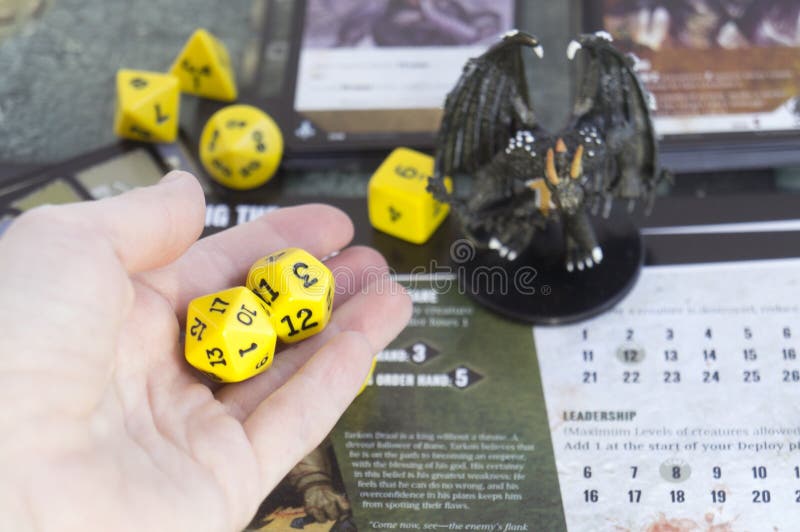 Roleplay game with dragons in dungeon. Yellow field dice Stock Photo by ©paulzhuk 178871342