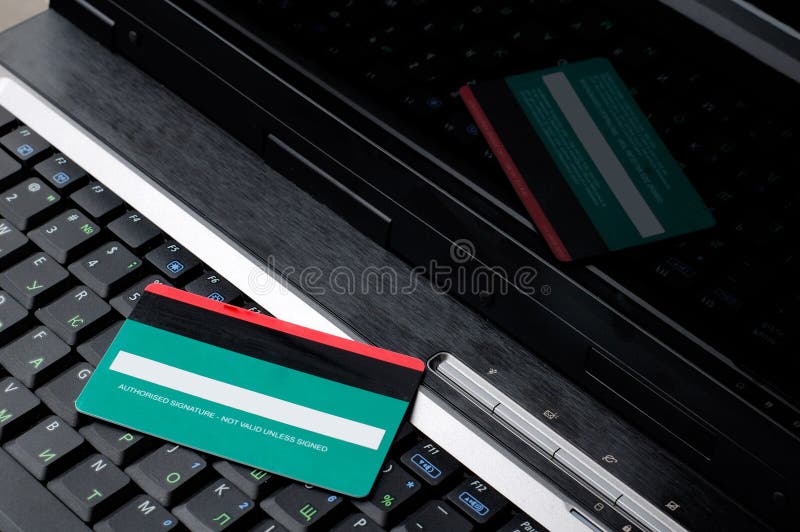 Credit card on a notebook keyboard. Credit card on a notebook keyboard