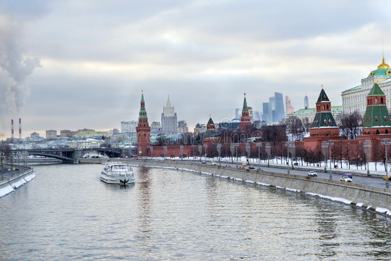 Kremlin embankment ,Moscow Kremlin, Russia, a pleasure boat on the river, city skyline stock photography Kremlin embankment ,Moscow Kremlin, Russia, a pleasure boat on the river, city skyline stock photography