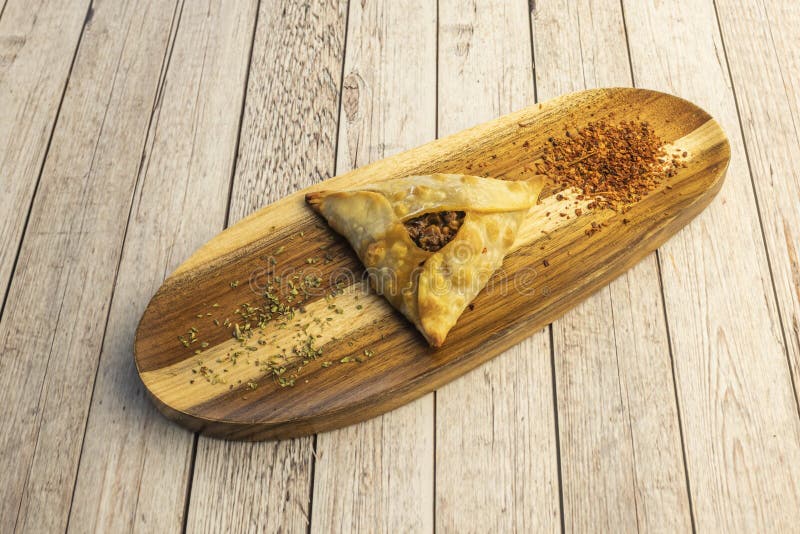 Creole pie with oregano and paprika on wooden board. Creole pie with oregano and paprika on wooden board