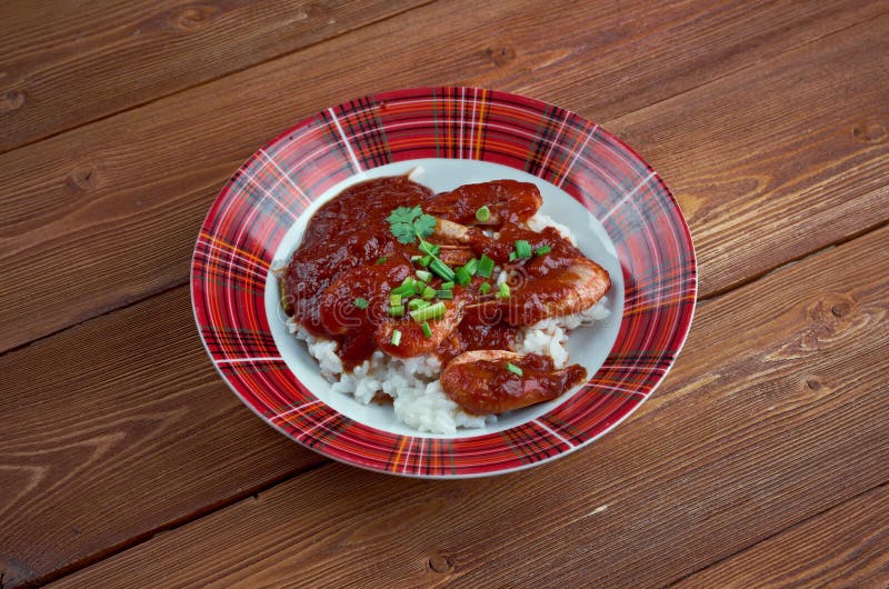 Shrimp Creole - dish of Louisiana Creole origin .cooked shrimp in mixture tomatoes, celery and bell pepper, spiced and served boiled white rice. Shrimp Creole - dish of Louisiana Creole origin .cooked shrimp in mixture tomatoes, celery and bell pepper, spiced and served boiled white rice