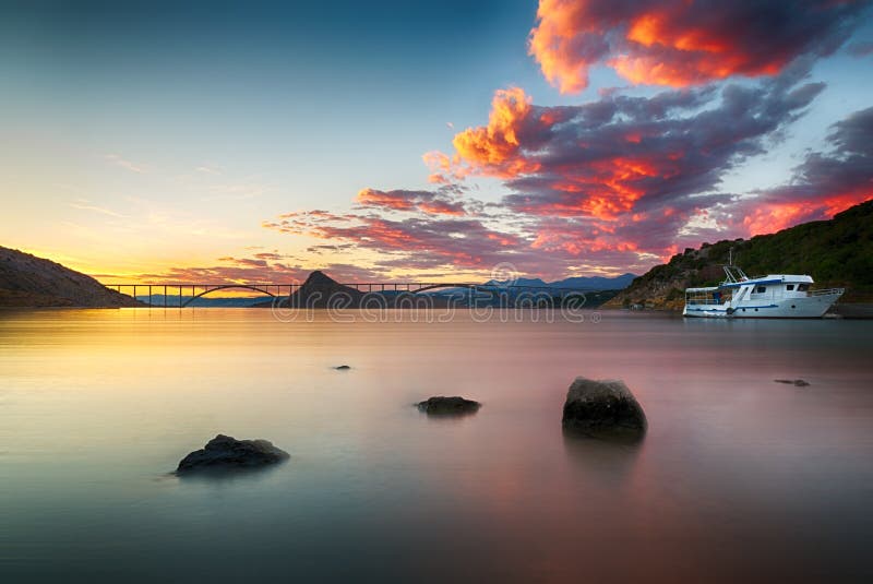 Krk bridge at dusk with colorful sunset, Croatia